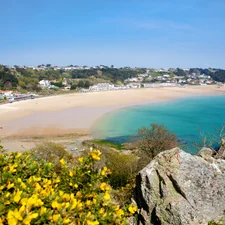 A landscape image of St Brelades Bay from the headland