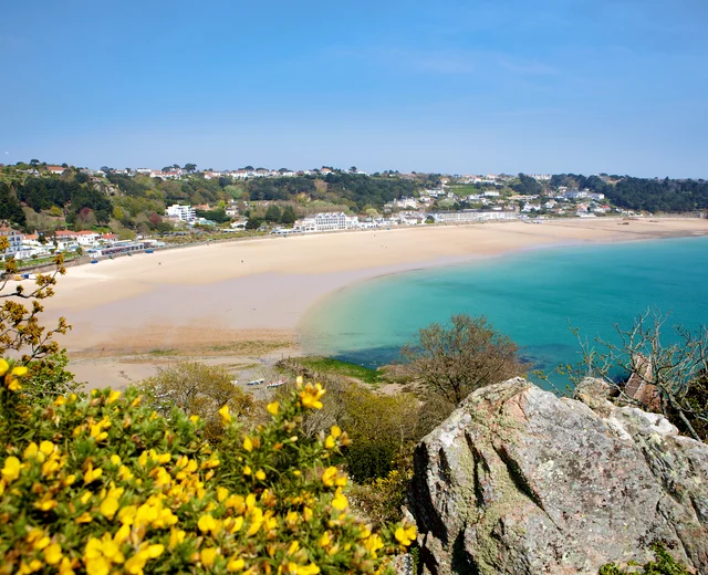 A landscape image of St Brelades Bay from the headland