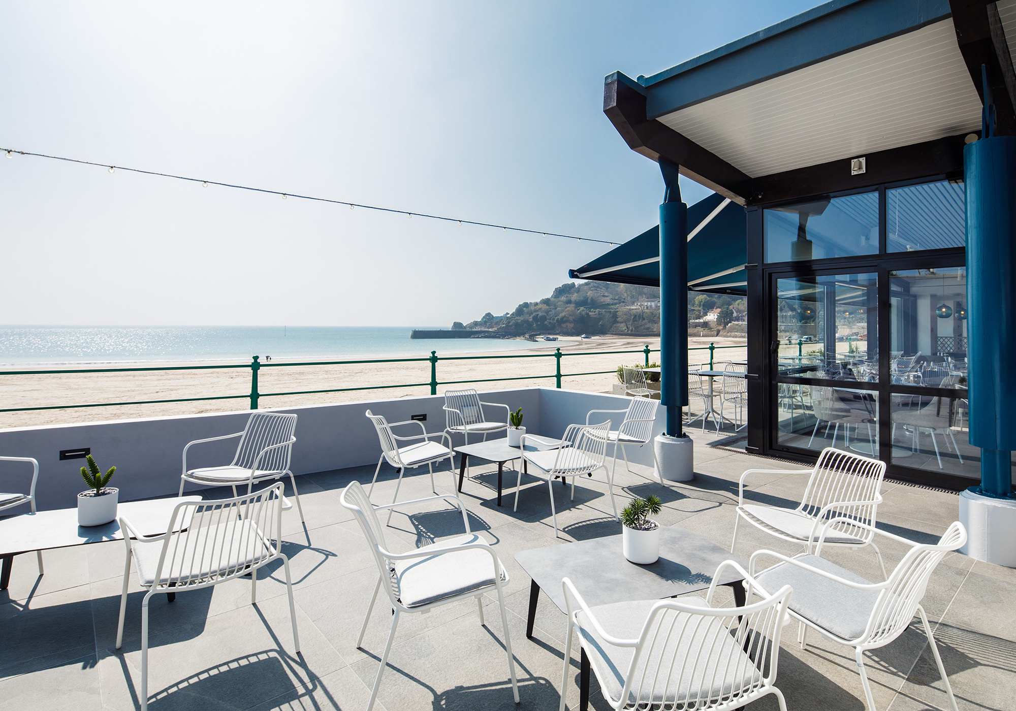 The terrace at Oyster Box featuring stylish outdoor seating on a sunny day
