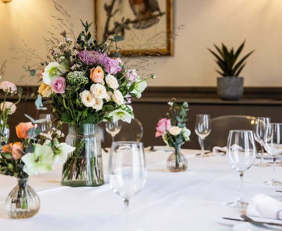 A large dining table in an elegant Victorian-style private room