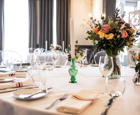 A large dining table in an elegant Victorian-style private room