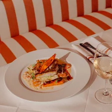 A seafood dish presented on an upscale dining table