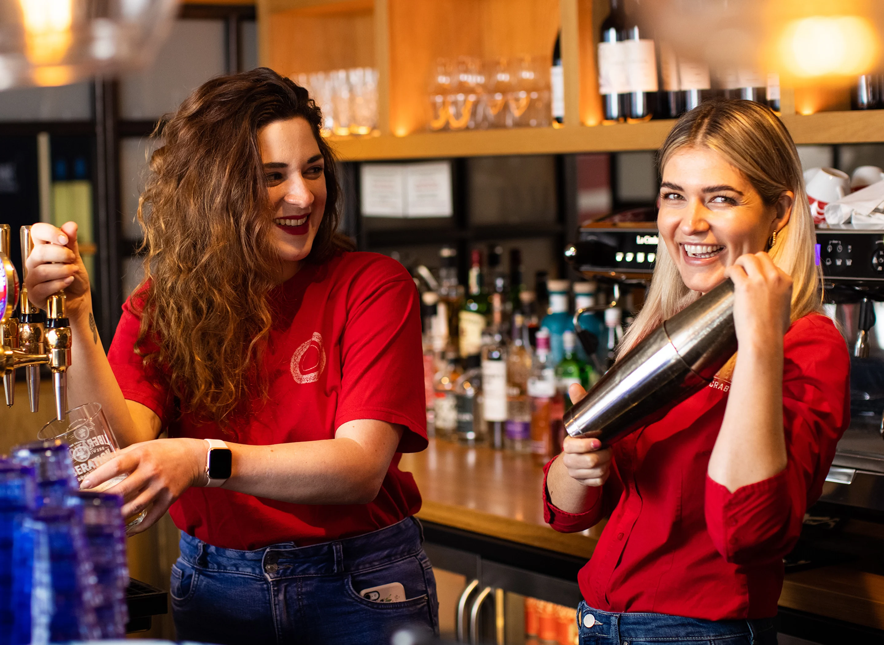 Two team members make drinks happily at Jersey Crab Shack