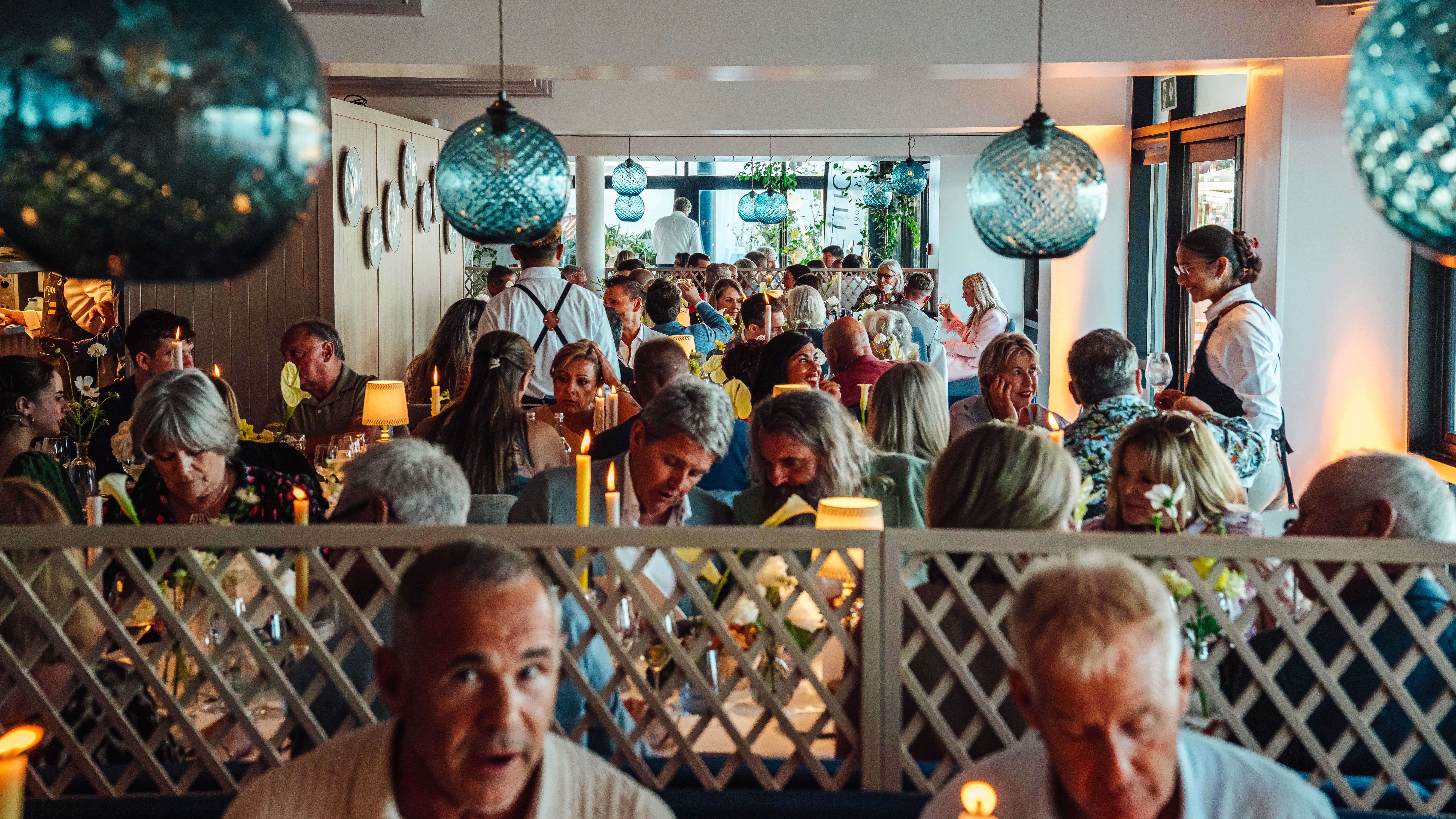 A private takeover event at Oyster Box, showing the dining area full of guests