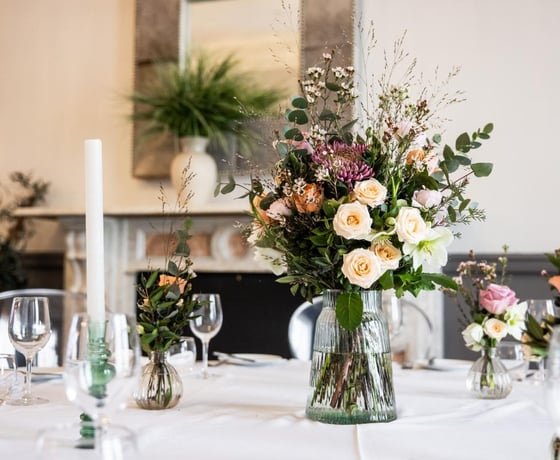 A large floral display at a private wedding event