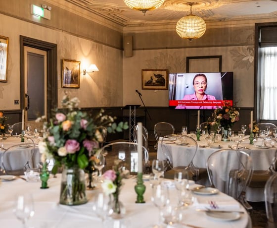 A presentation screen at a private event