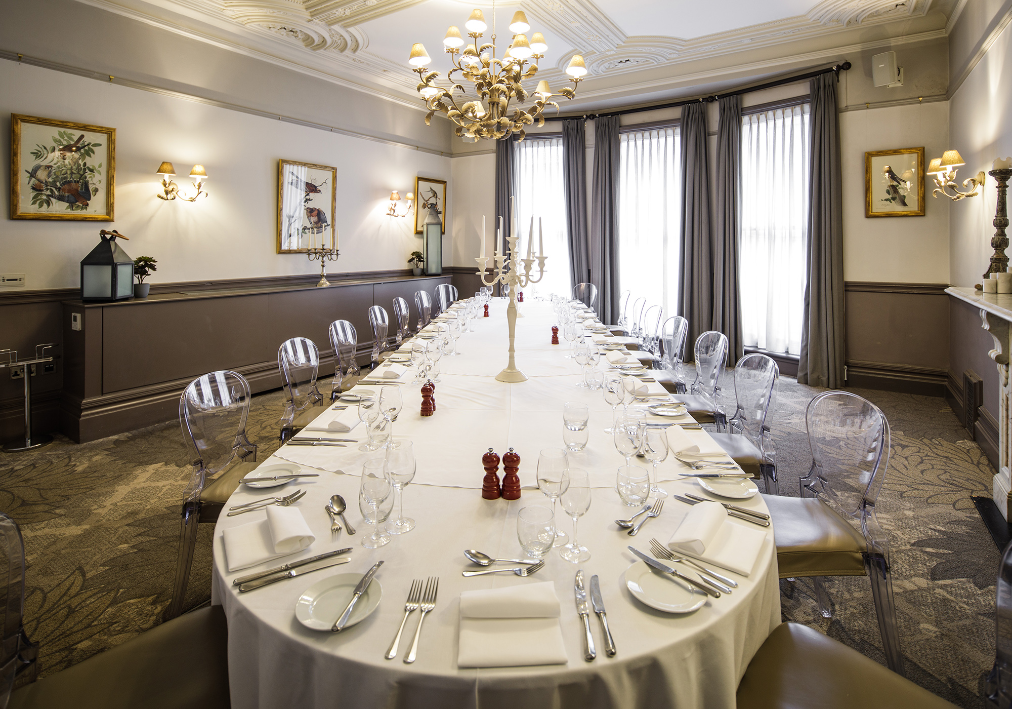 A large dining table in an elegant Victorian-style private room