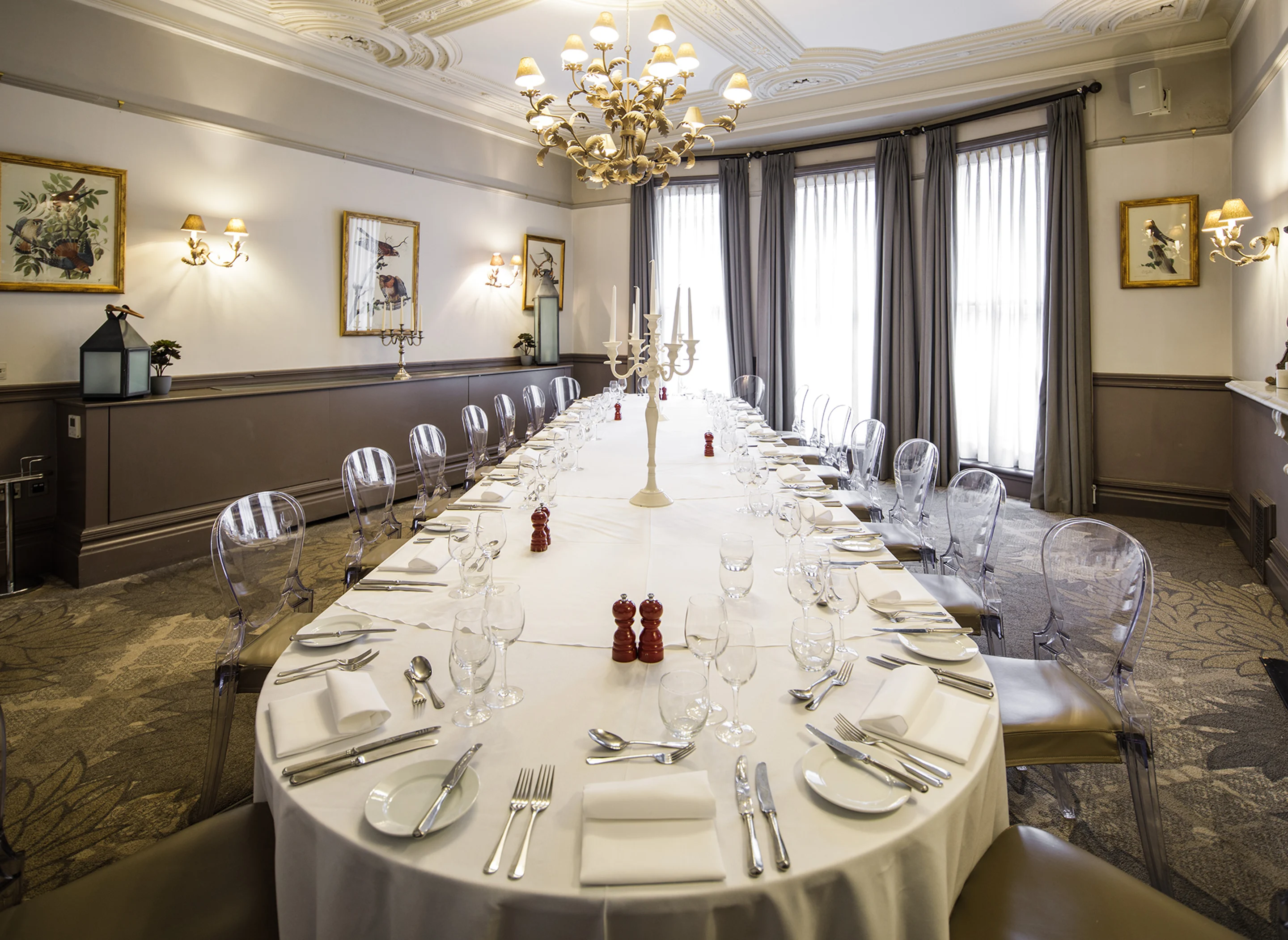 A large dining table in an elegant Victorian-style private room