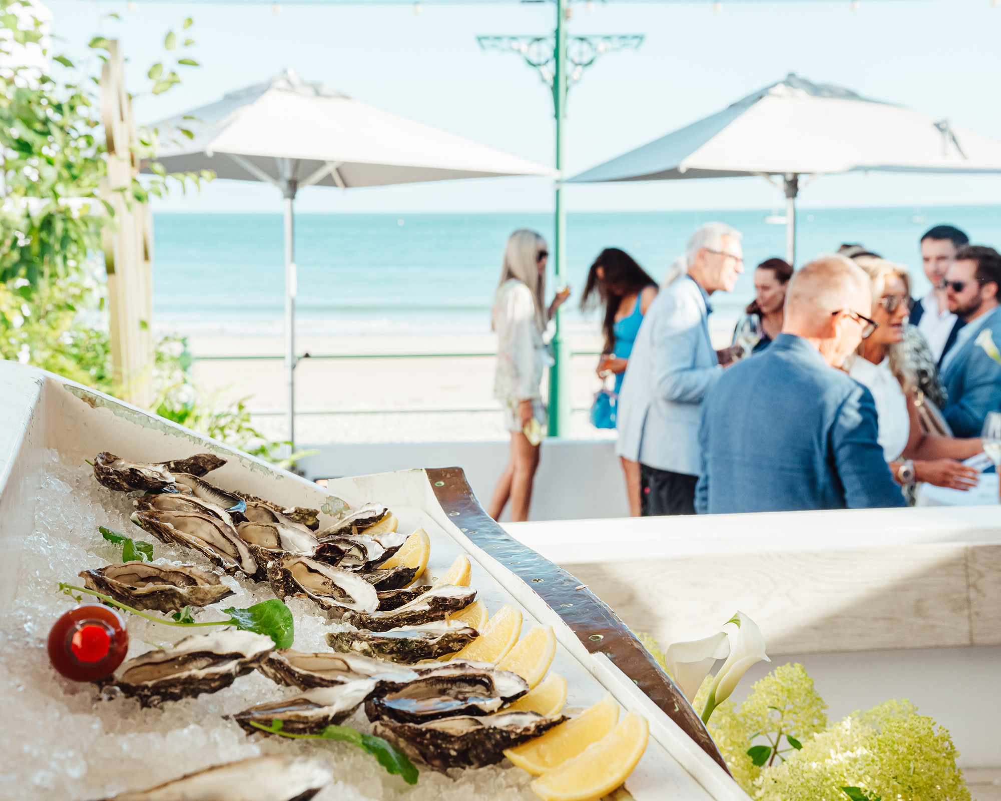 Guests enjoy oysters at a private event on the Oyster Box terrace