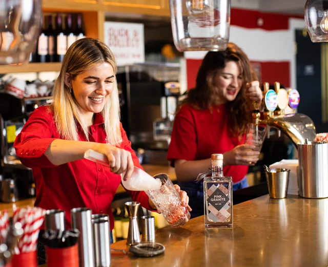 Two women prepare bar drinks at Jersey Crab Shack