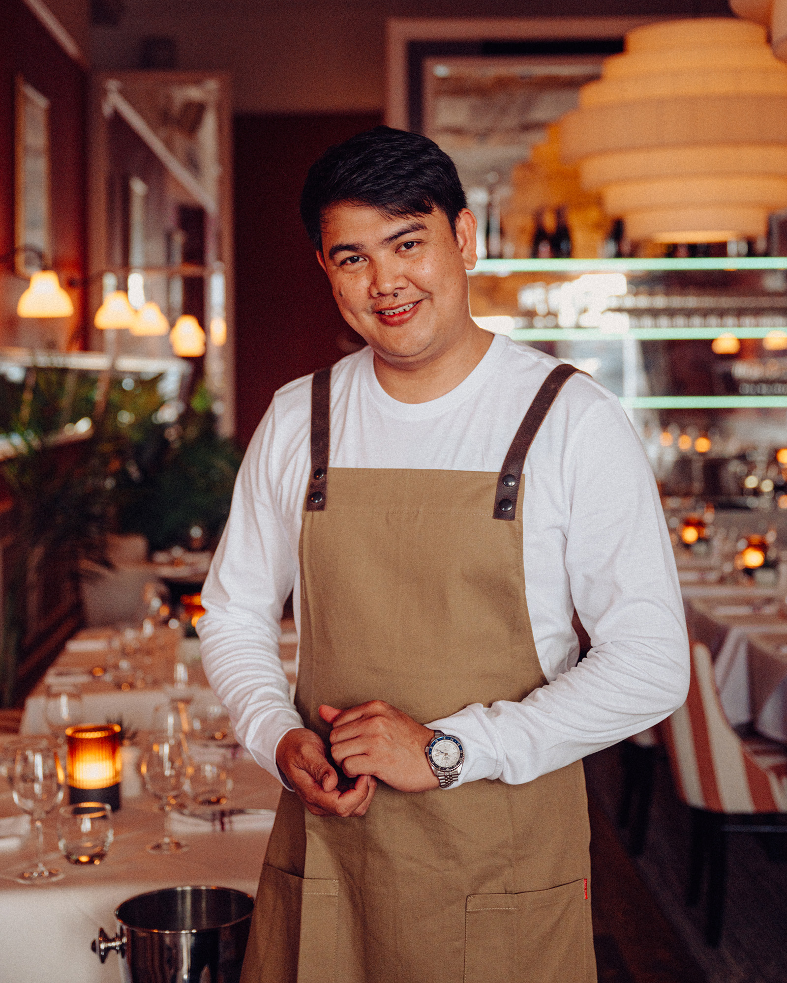 A server stands happily in the Beresford House dining room
