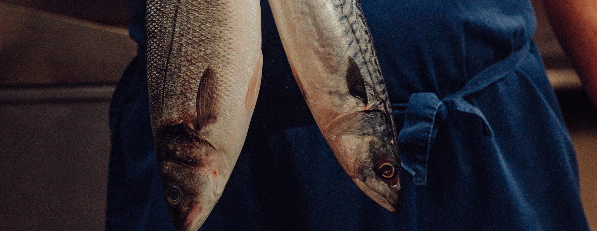 Fresh local fish, held by a JP Restaurants team member
