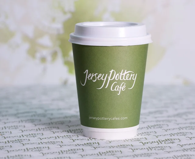 An image of a Jersey Pottery Cafe branded coffee cup, circa 2015
