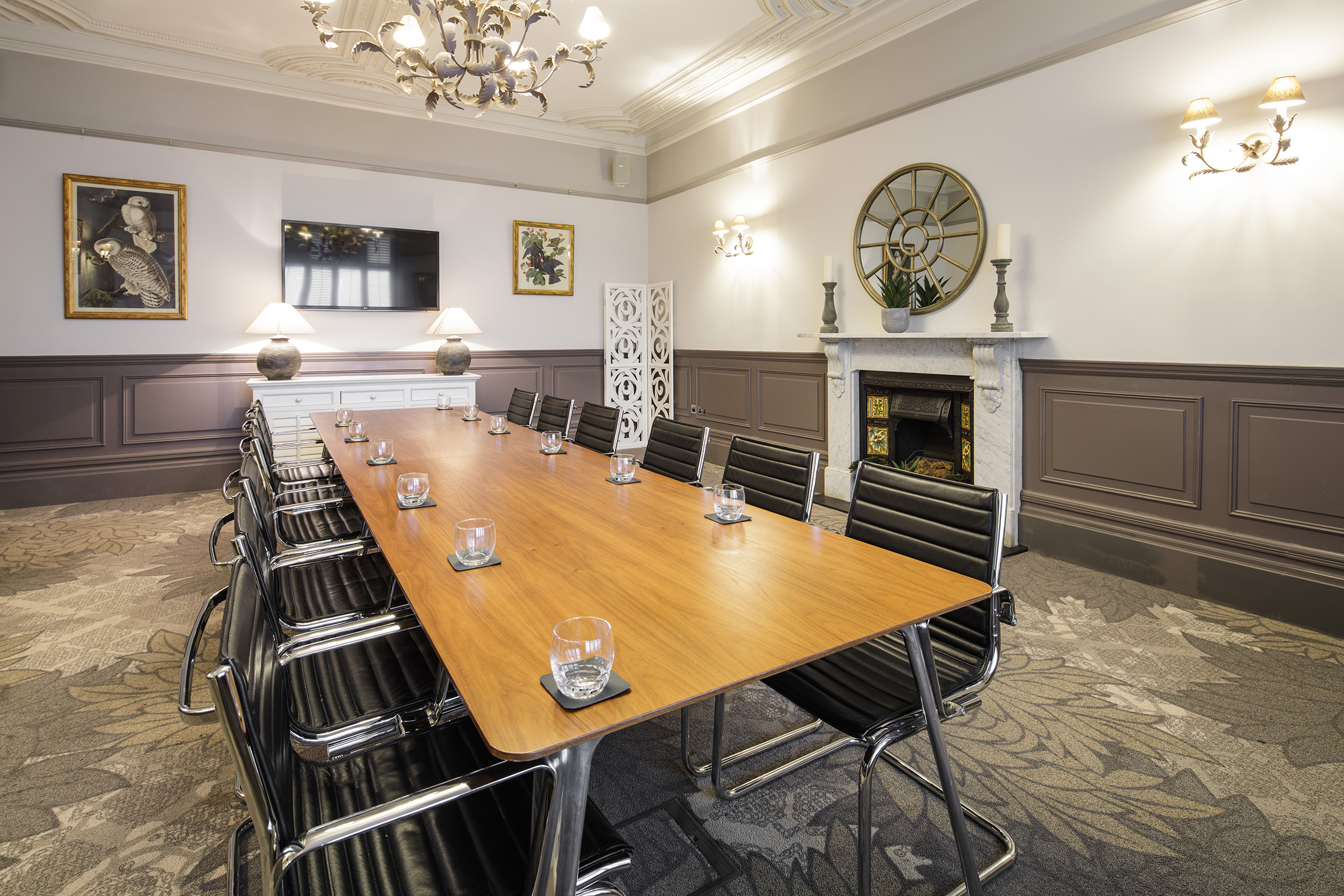 A large boardroom table in a Victorian meeting room