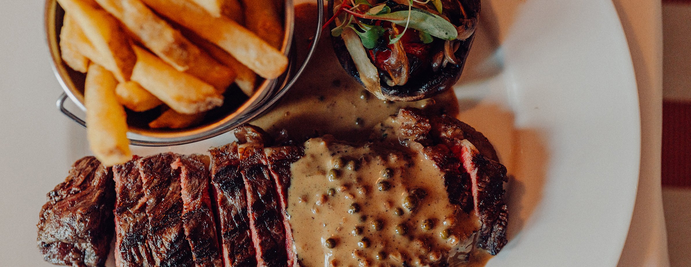 A steak served with peppercorn sauce