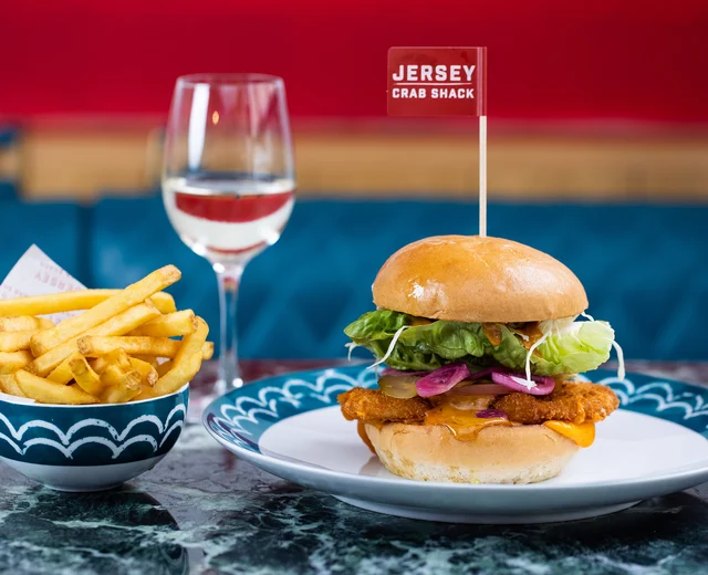 A chicken burger with a Jersey Crab Shack flag
