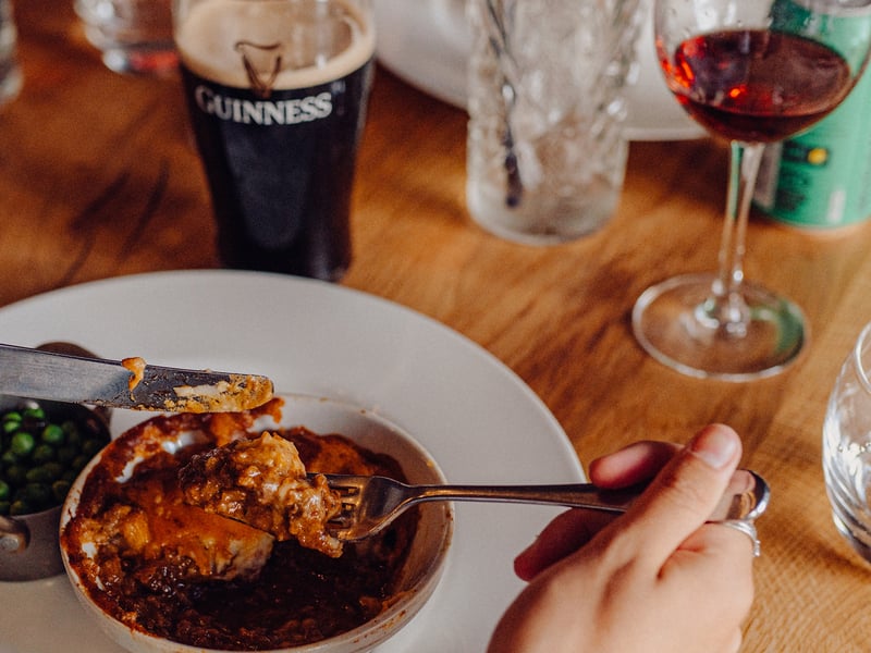 A customer enjoys Shepherds Pie at The Old Vic